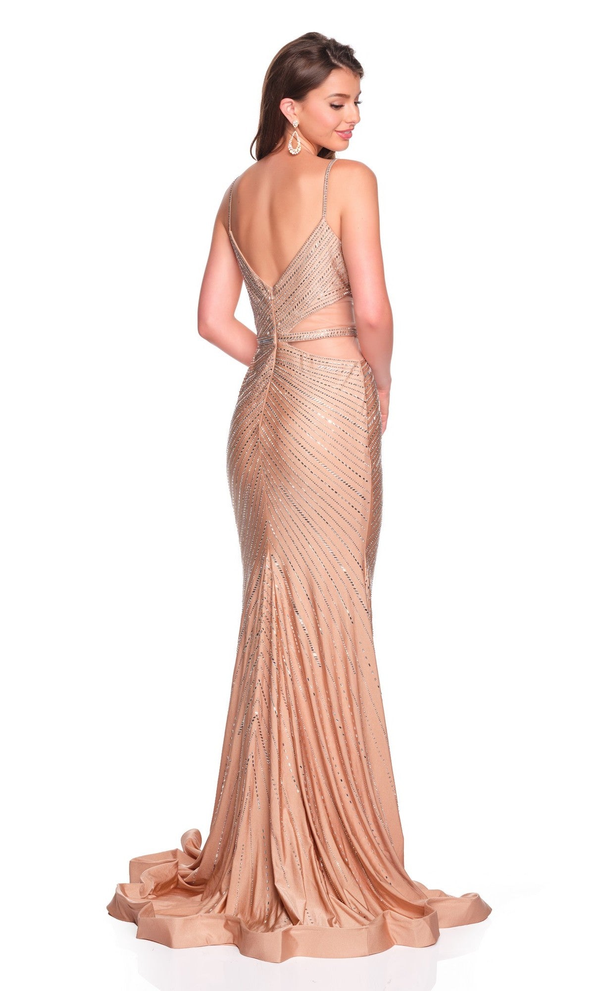 A woman stands facing away, wearing the Long Prom Dress: Dave and Johnny 12909—a floor-length champagne gown with thin straps, an open back, and sparkling beaded embellishments.